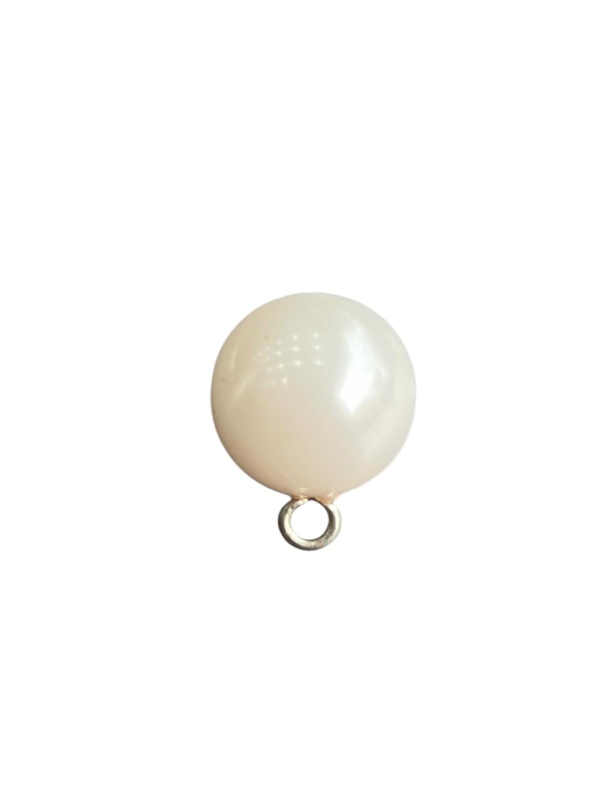 A single 15mm round white plastic pearl shank button for sewing.