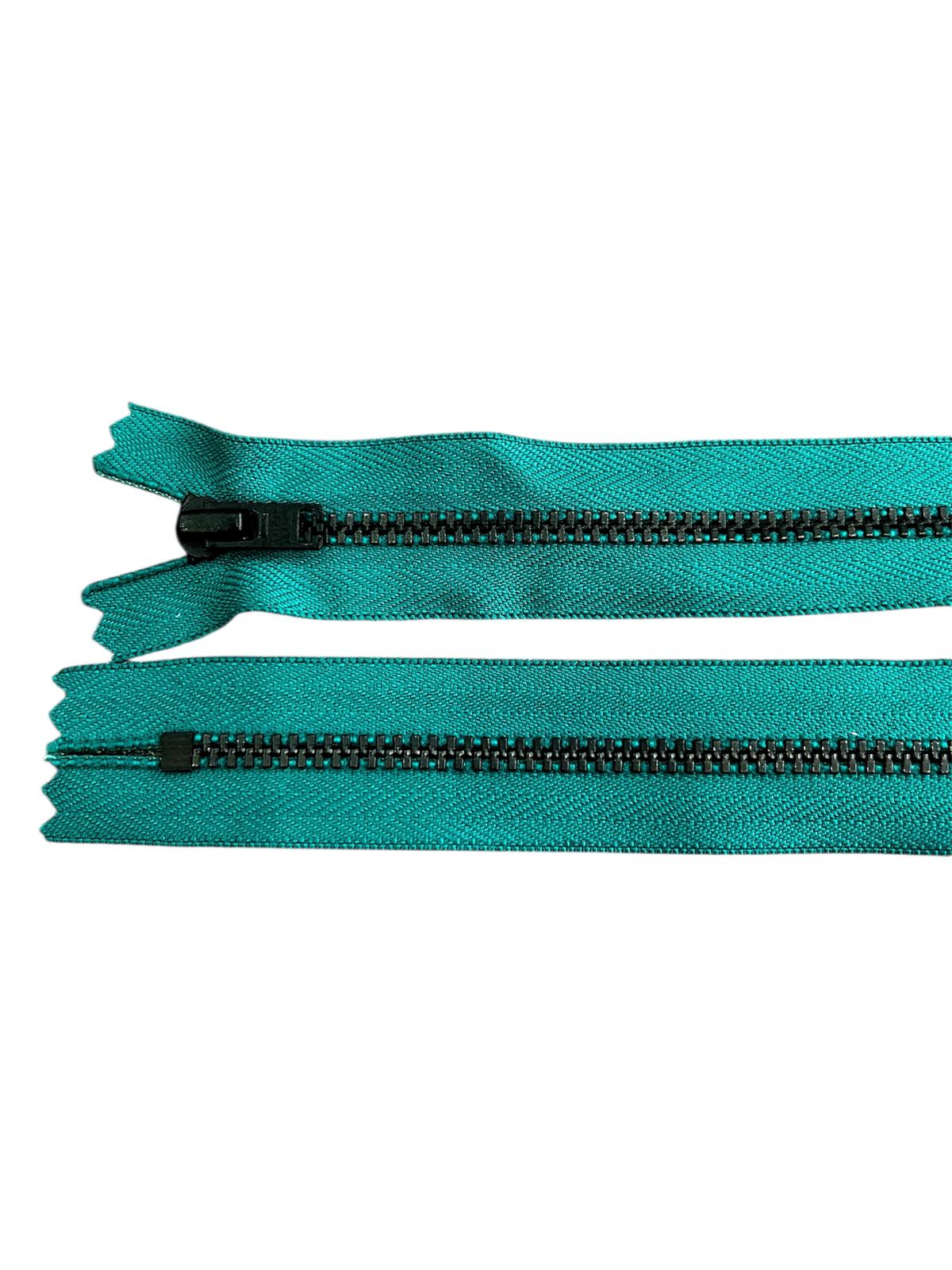 Two teal zippers with black metal teeth and sliders on a white background.
