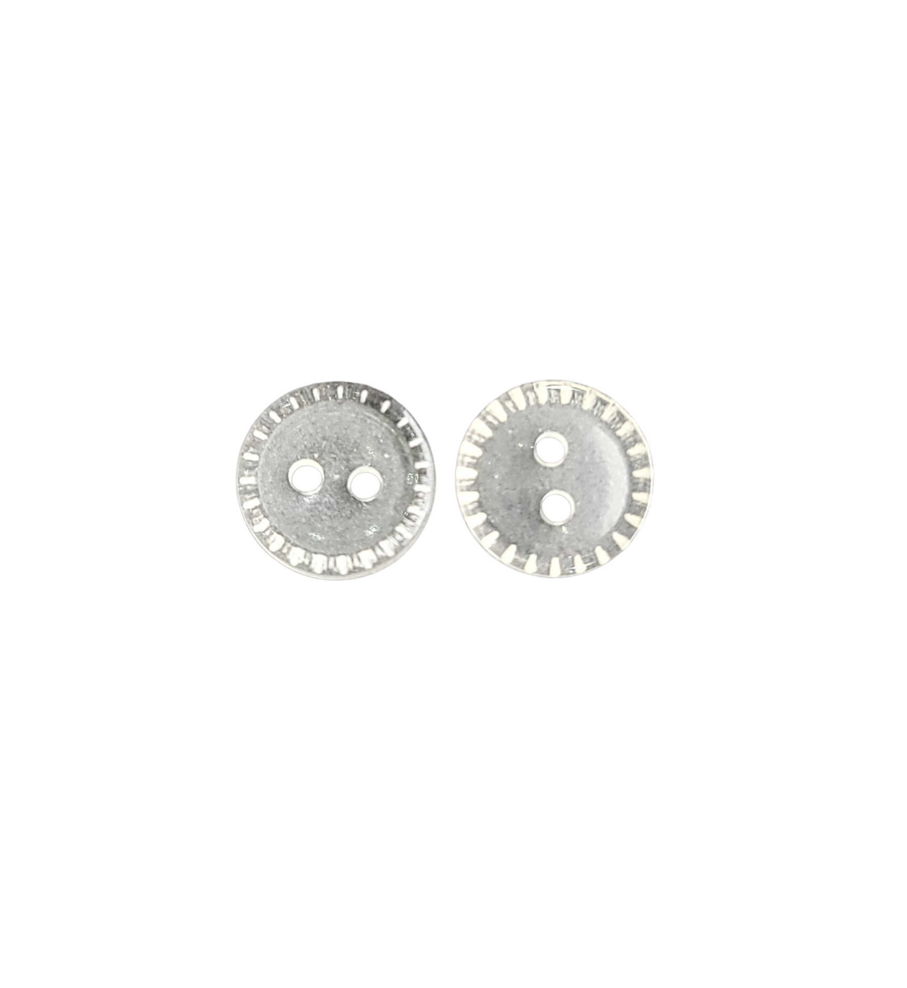 Two clear cream 11mm round buttons with two holes and a decorative ridged border.