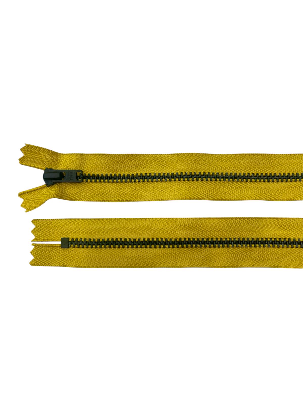 Yellow YKK size 3 closed-end black metal zipper.