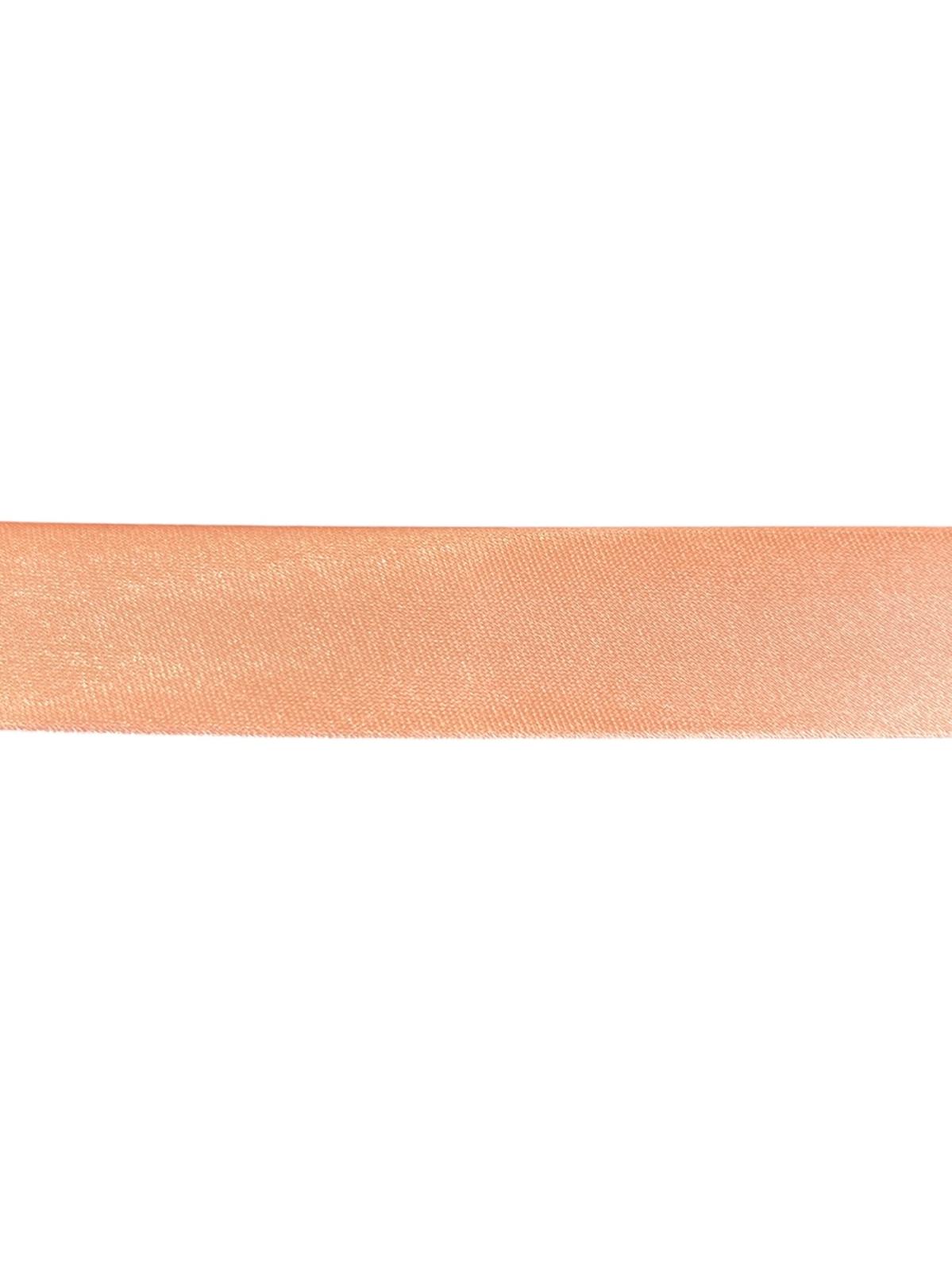 Peach satin bias binding tape for sewing and crafting projects.