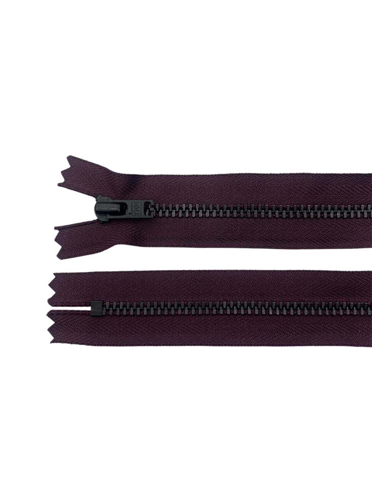 Two YKK size 3 closed-end black metal zippers on a white background.