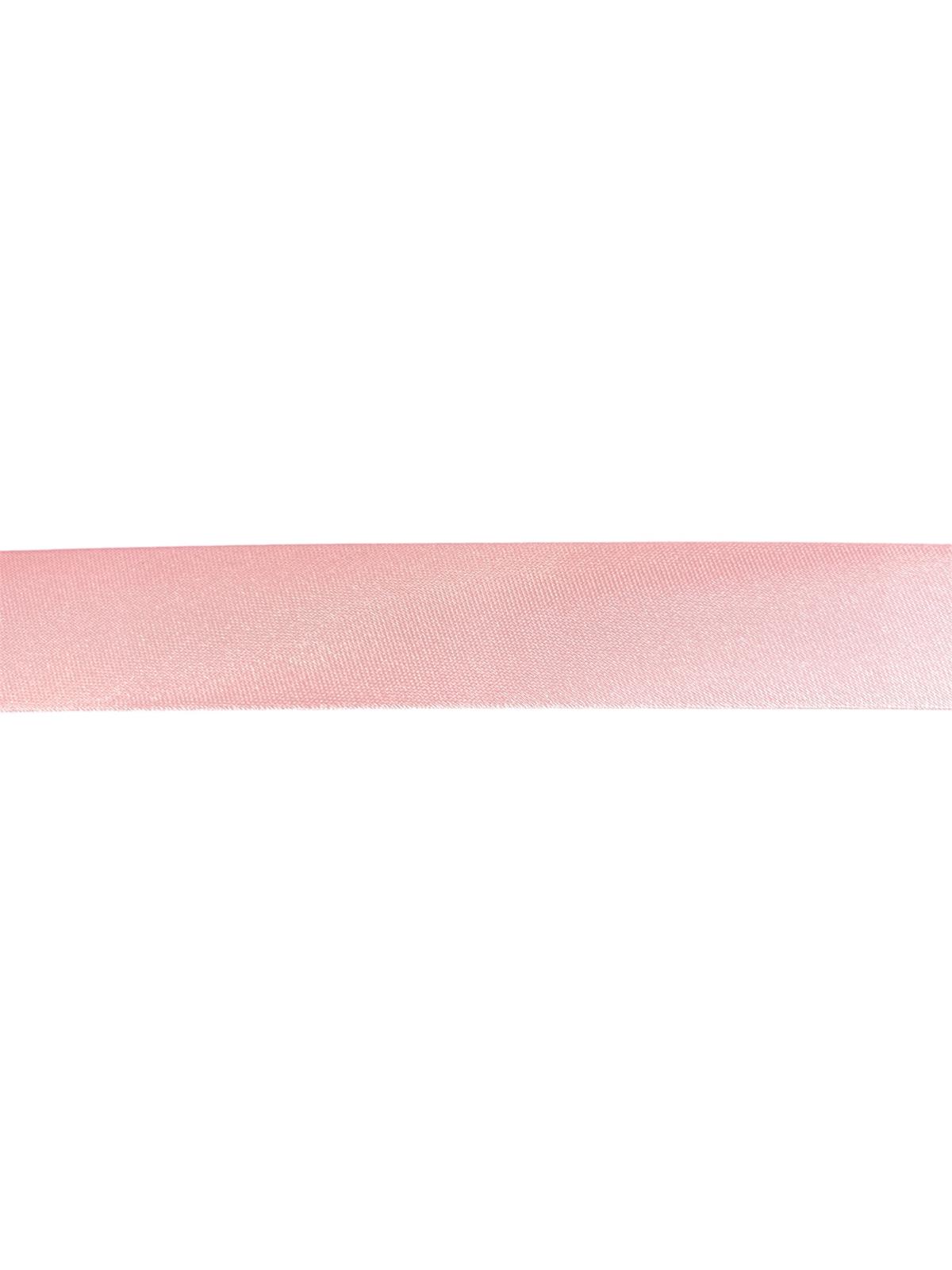 Light pink satin bias binding tape for sewing and crafting.