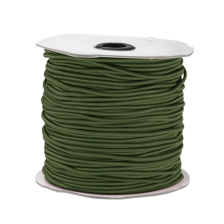 Spool of olive green Beadalon elastic cord for jewelry making on a white background.