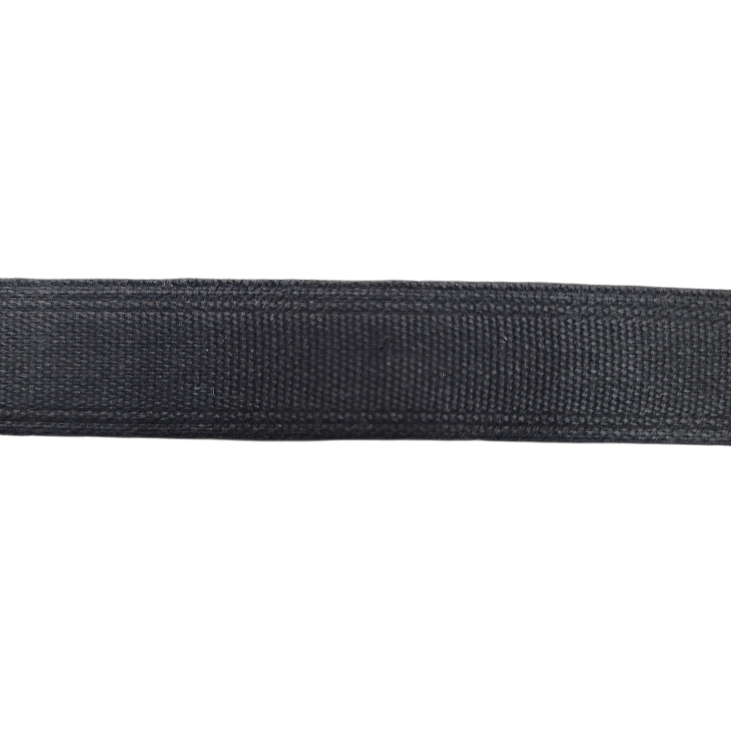 Close-up of black tunnel tape casing for corset boning against a white background.