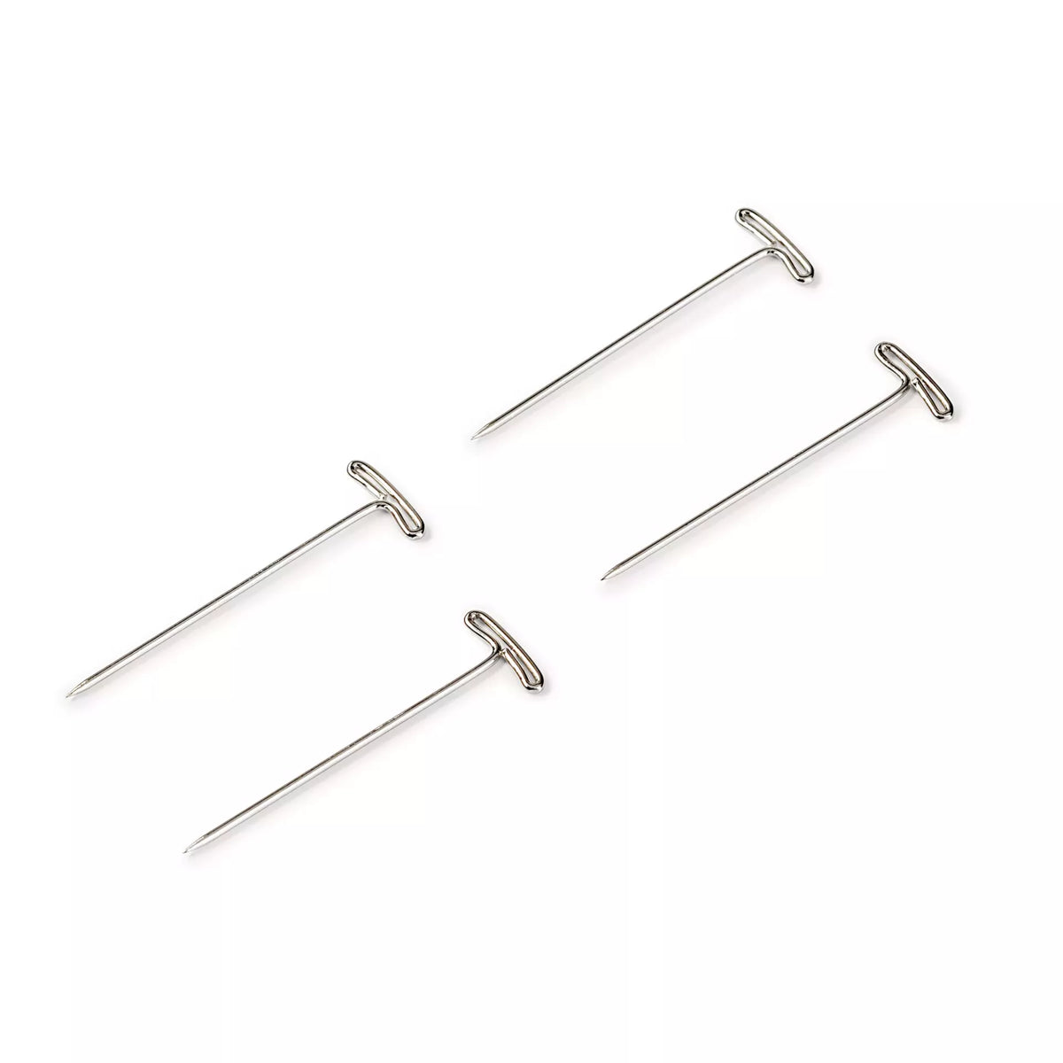 Four silver-coloured steel T-shaped head pins on a white background.