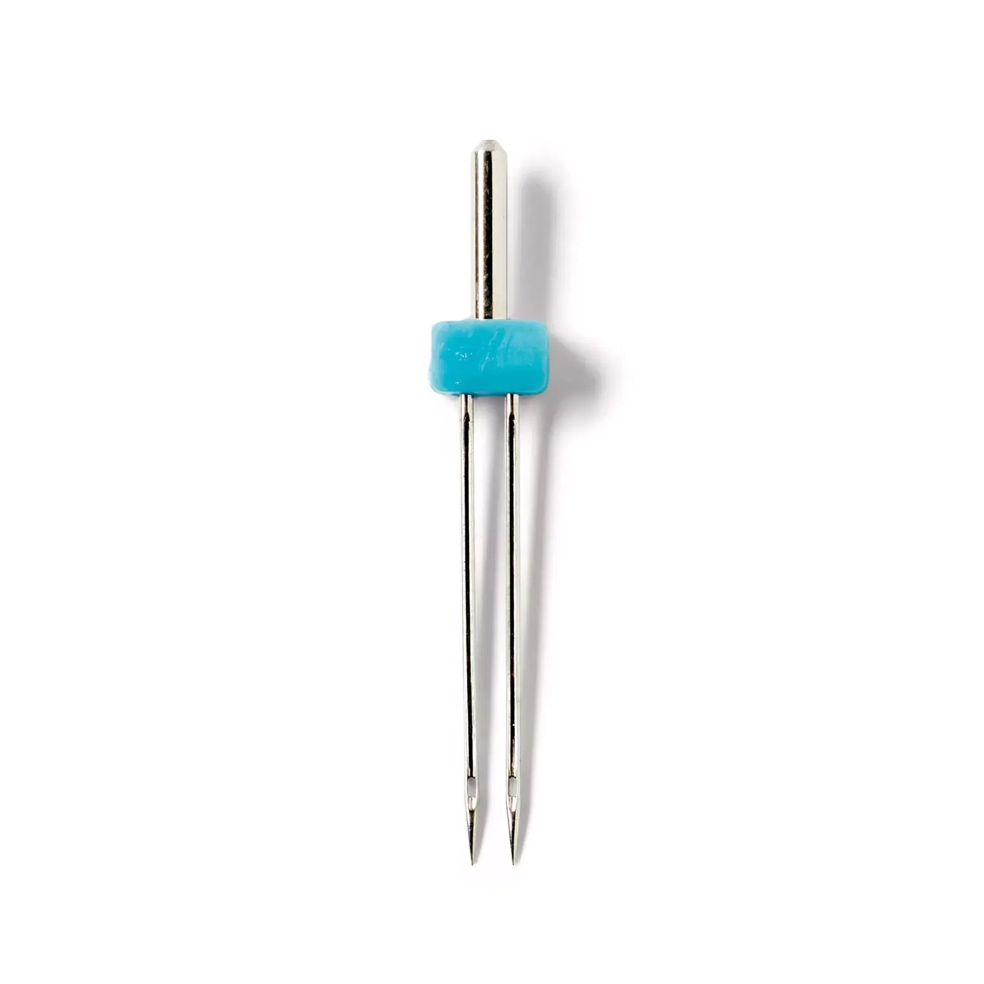 Prym double sewing machine needles with a silver-colored finish and a blue plastic connector.