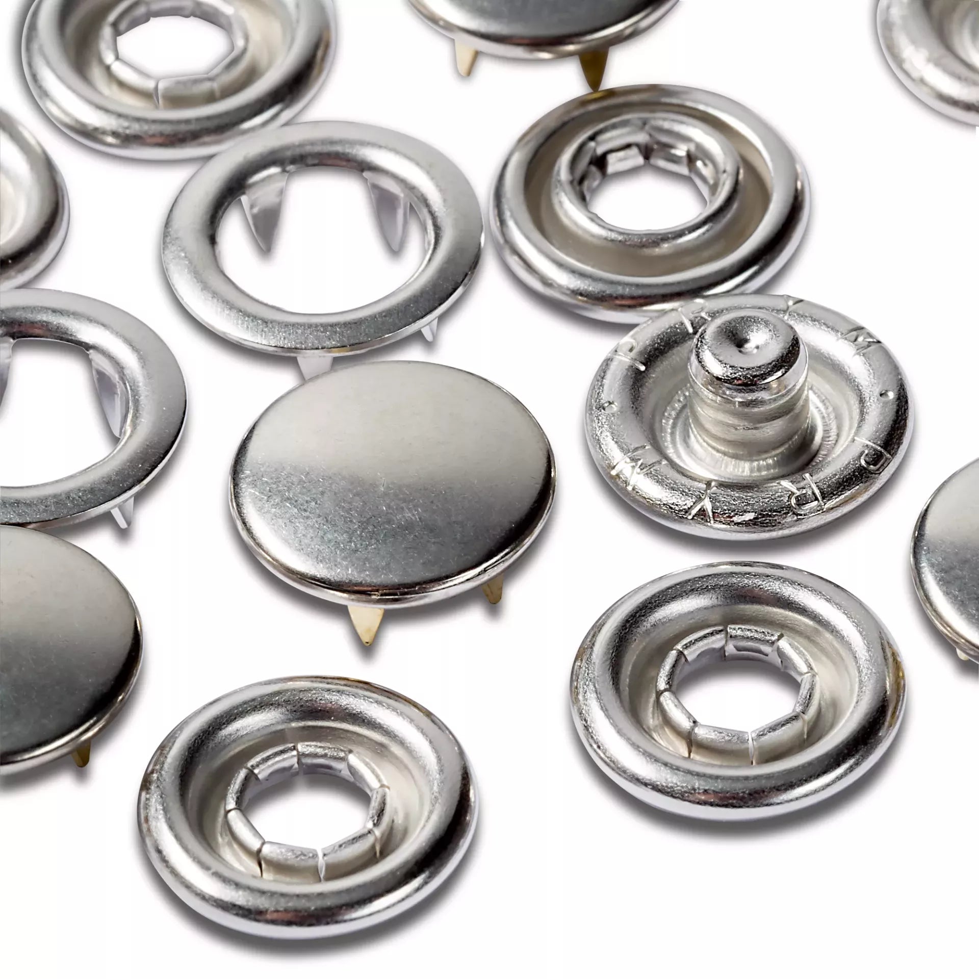 Prym 10mm silver-coloured jersey press fasteners with smooth caps and serrated rings.