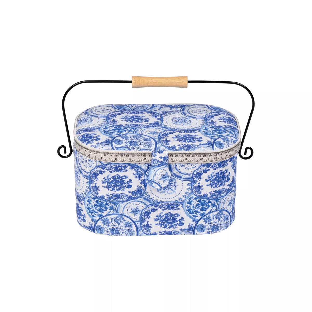 Large oval sewing basket with Delft Blue floral pattern, iron handle, and wooden grip.
