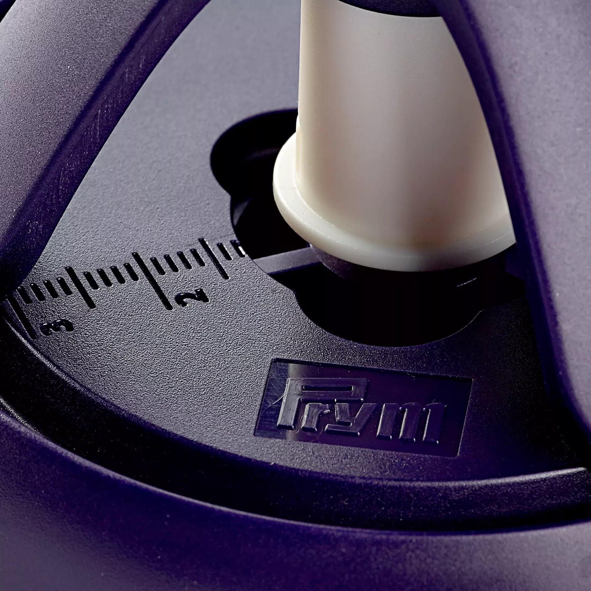 Close-up of a violet Prym tripod tool showing the measurement scale and brand logo.