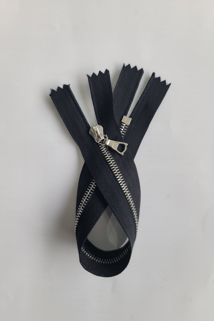 RIRI black 20cm closed end zipper with silver metal M4 fastener.