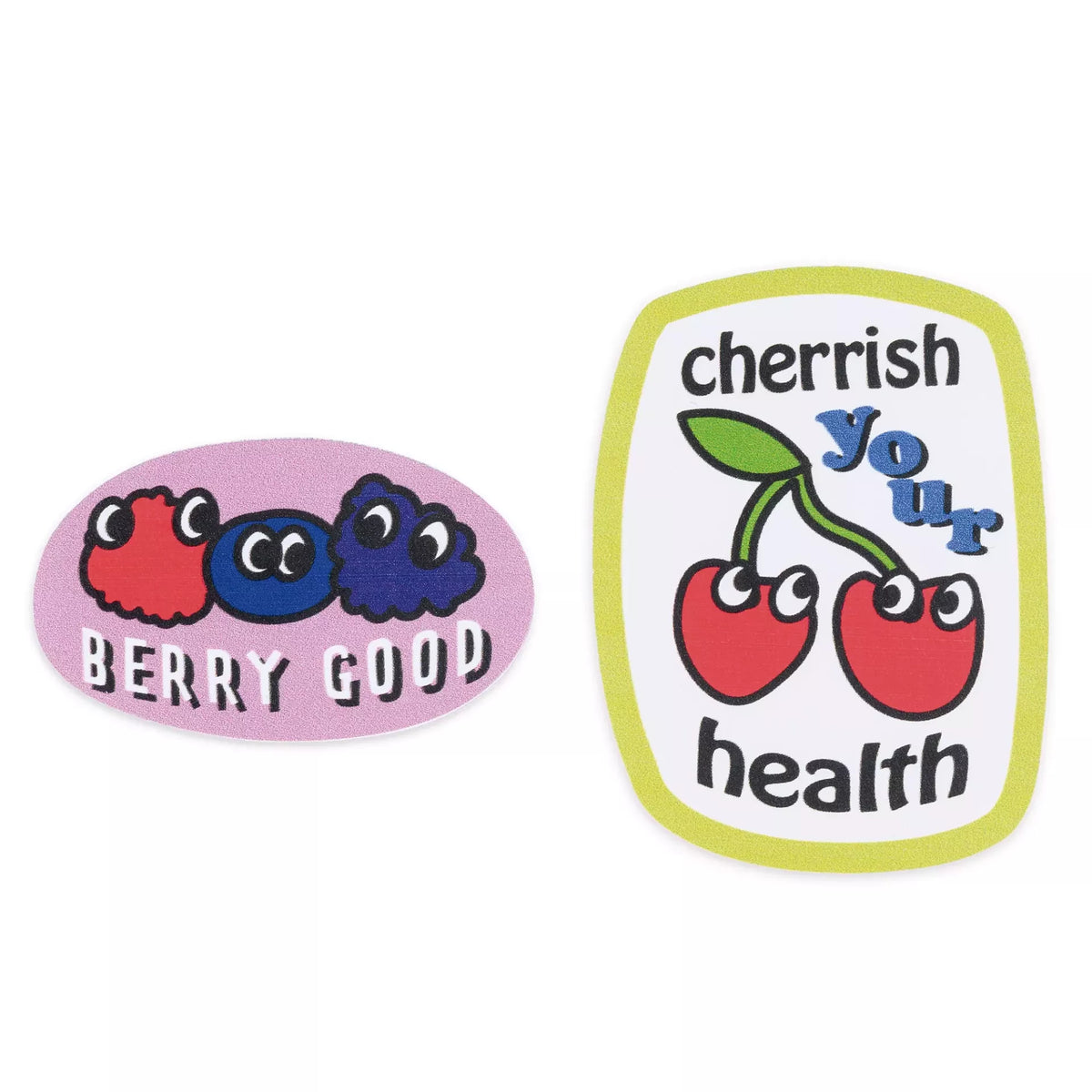Two colorful fruit-themed appliqués: one with berries and 'BERRY GOOD', one with 'cherrish your health'.