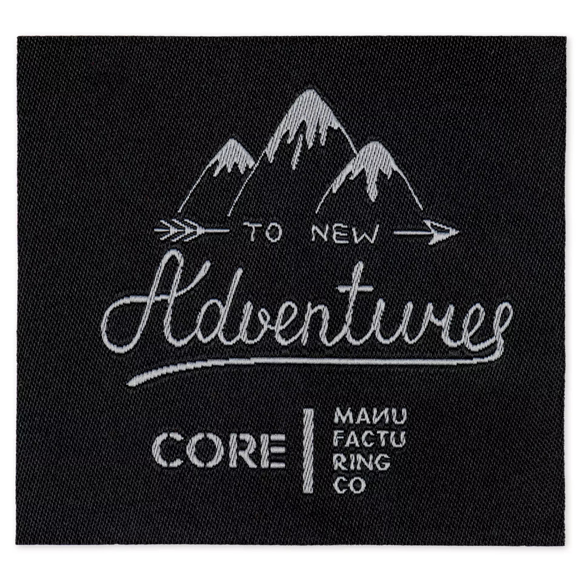 Black iron-on appliqué featuring a mountain range and the text To New Adventures.