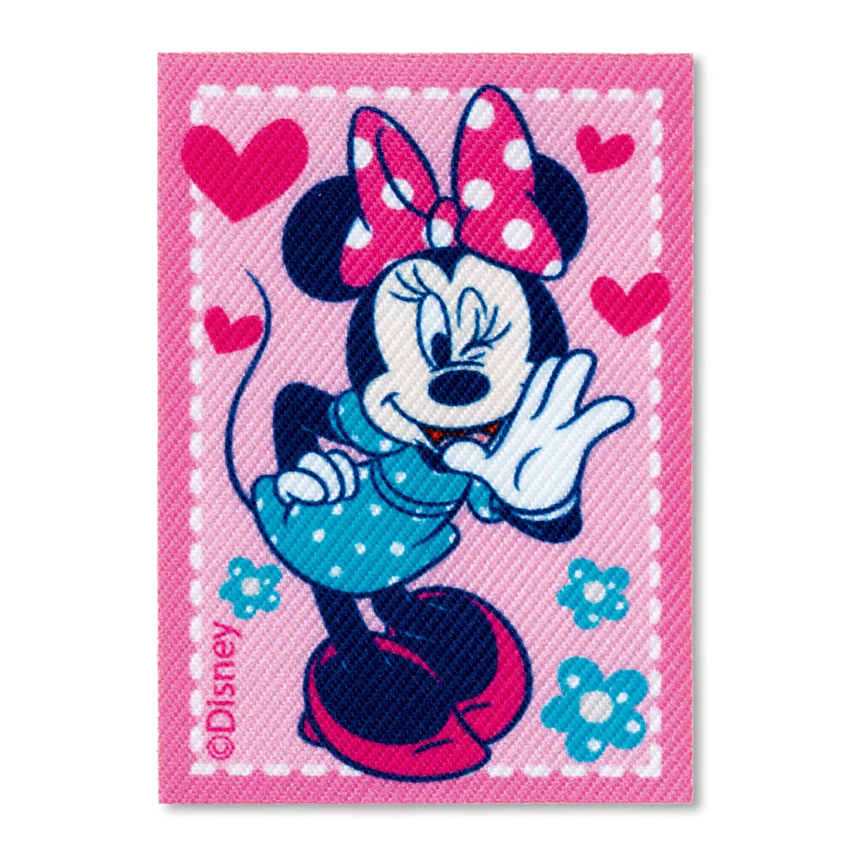 Prym iron-on appliqué featuring Minnie Mouse in a blue dress on a pink background with hearts.