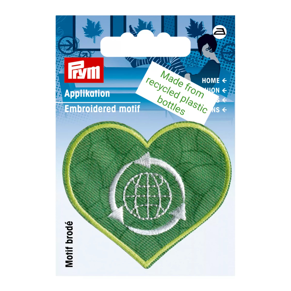Prym green heart-shaped embroidered appliqué with a white globe and recycling arrows motif.