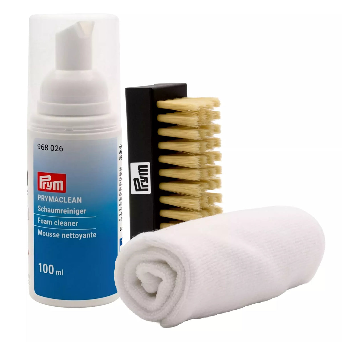 Sneaker care set including 100ml foam cleaner, a black cleaning brush, and a white microfiber cloth.