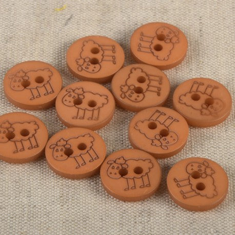 A collection of round, brown 15mm polyester sewing buttons featuring an engraved sheep design.