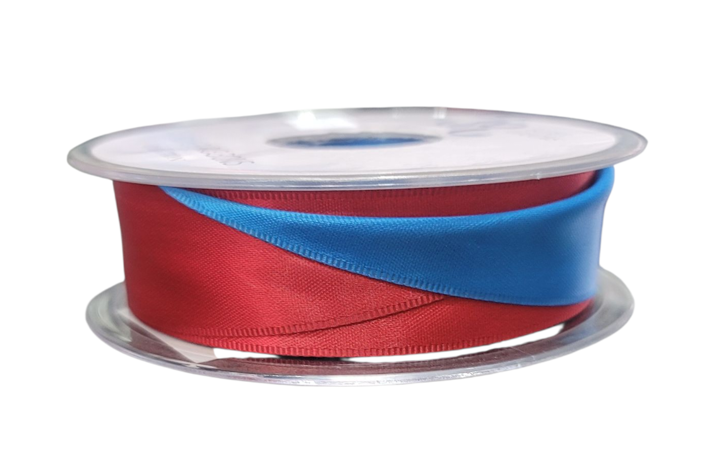 A spool of red and blue satin ribbon for crafts.