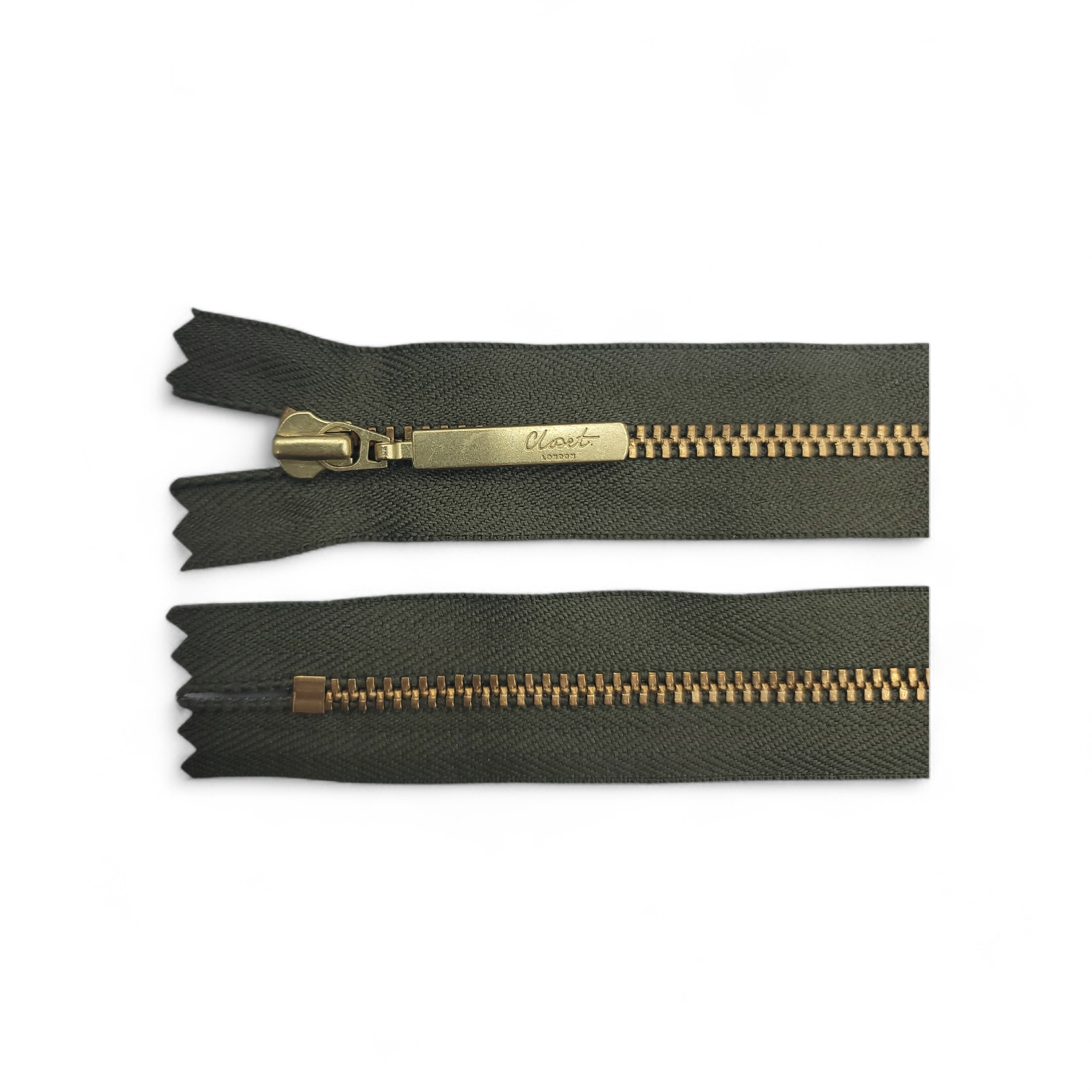 YKK size 3 closed end gold metal zip with dark green tape.