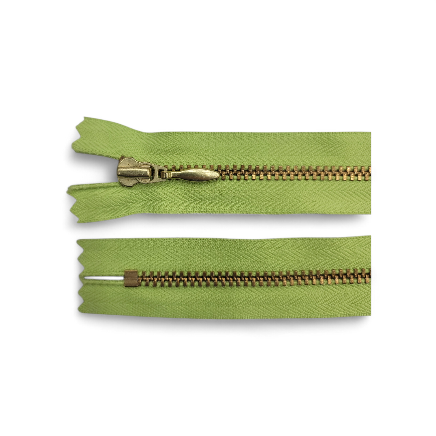 YKK size 3 closed end gold metal zipper with light green fabric.