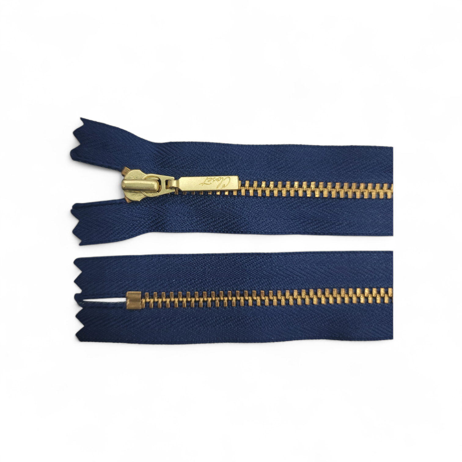 YKK size 3 closed end gold metal zipper on navy blue tape.