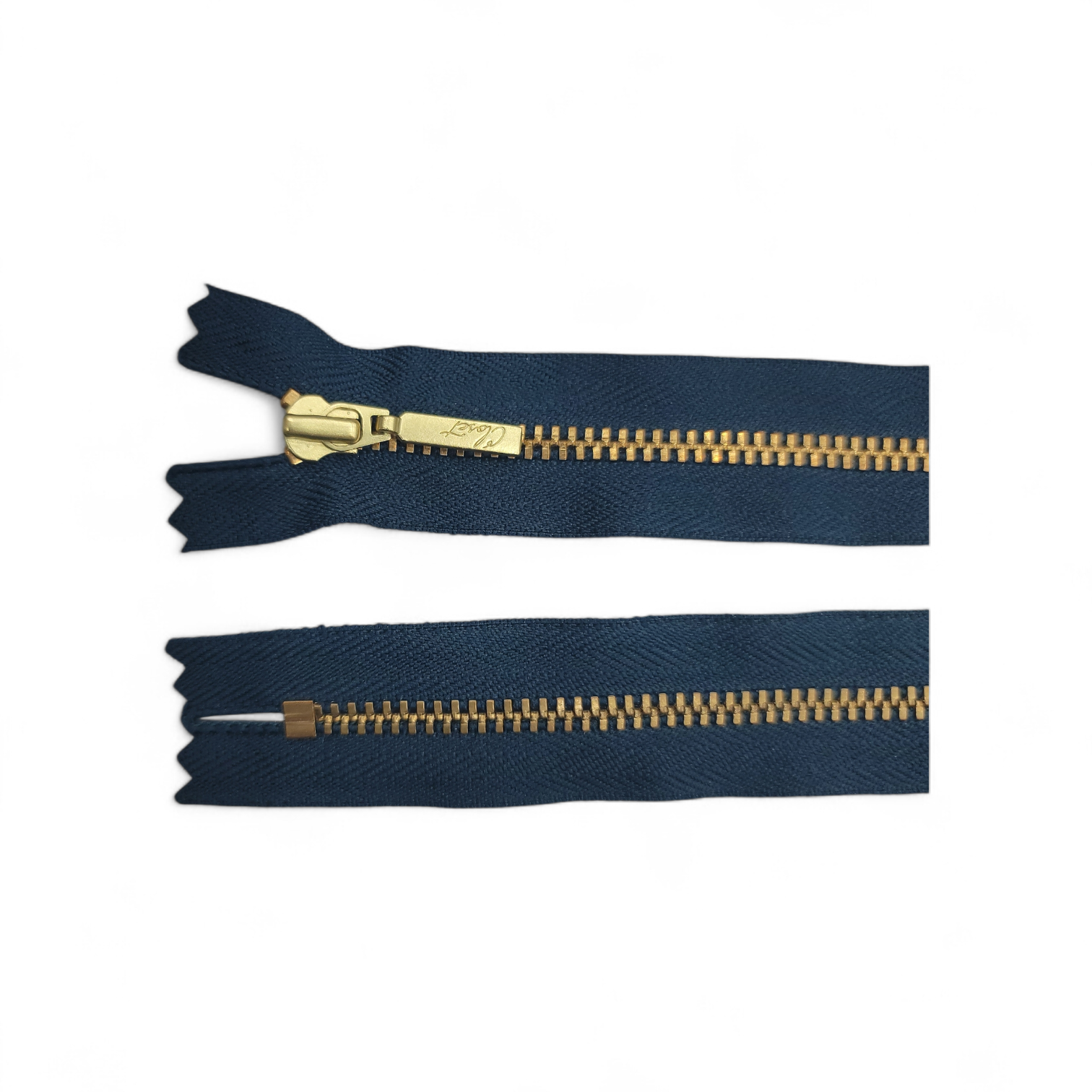 YKK size 3 closed end gold metal zipper with navy blue tape.