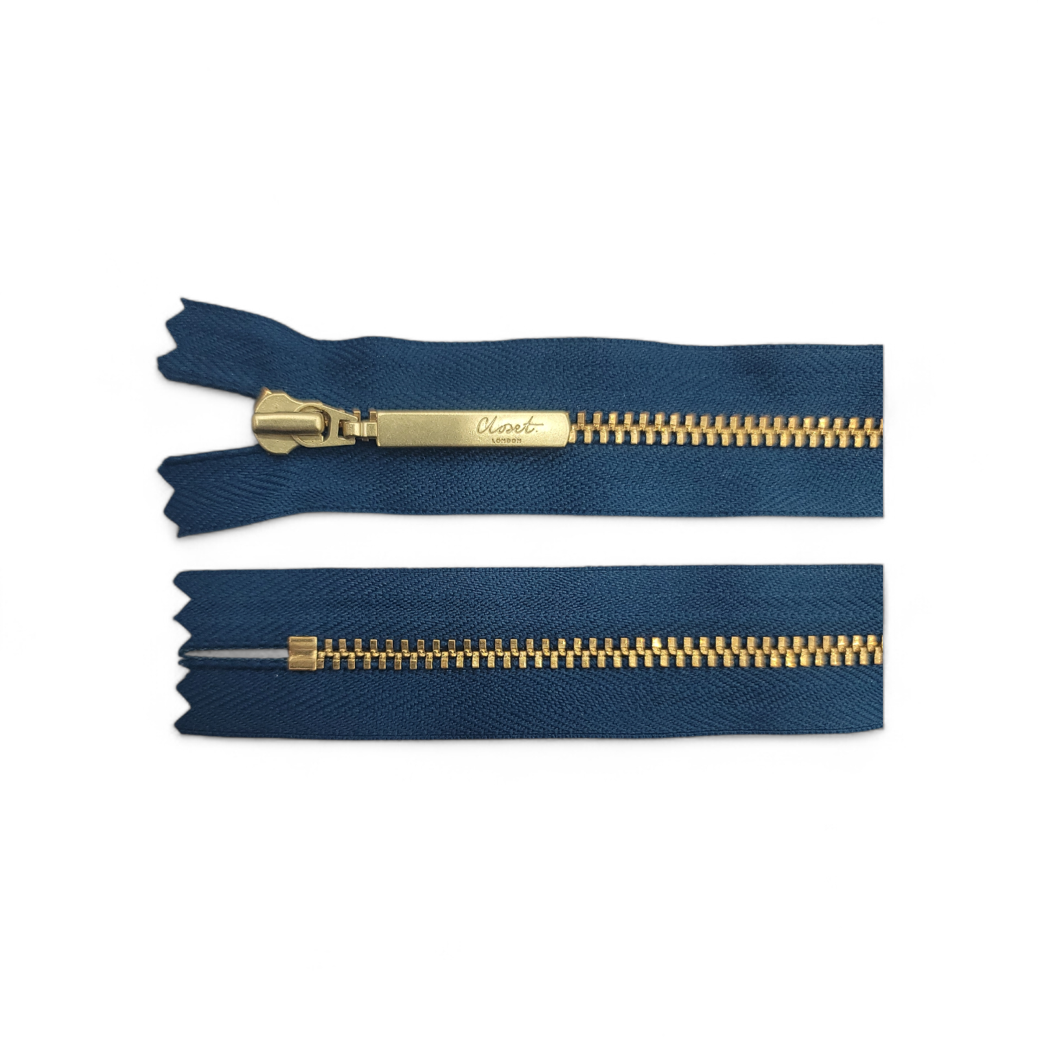 Closed end dark blue zipper with gold teeth and pull tab.