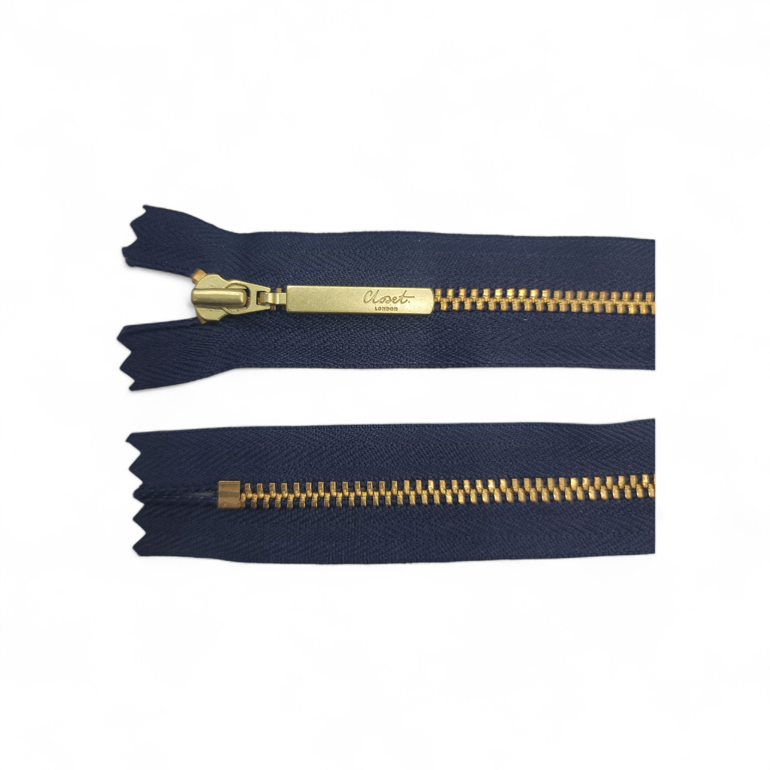 YKK size 3 closed end gold metal zip with navy tape.