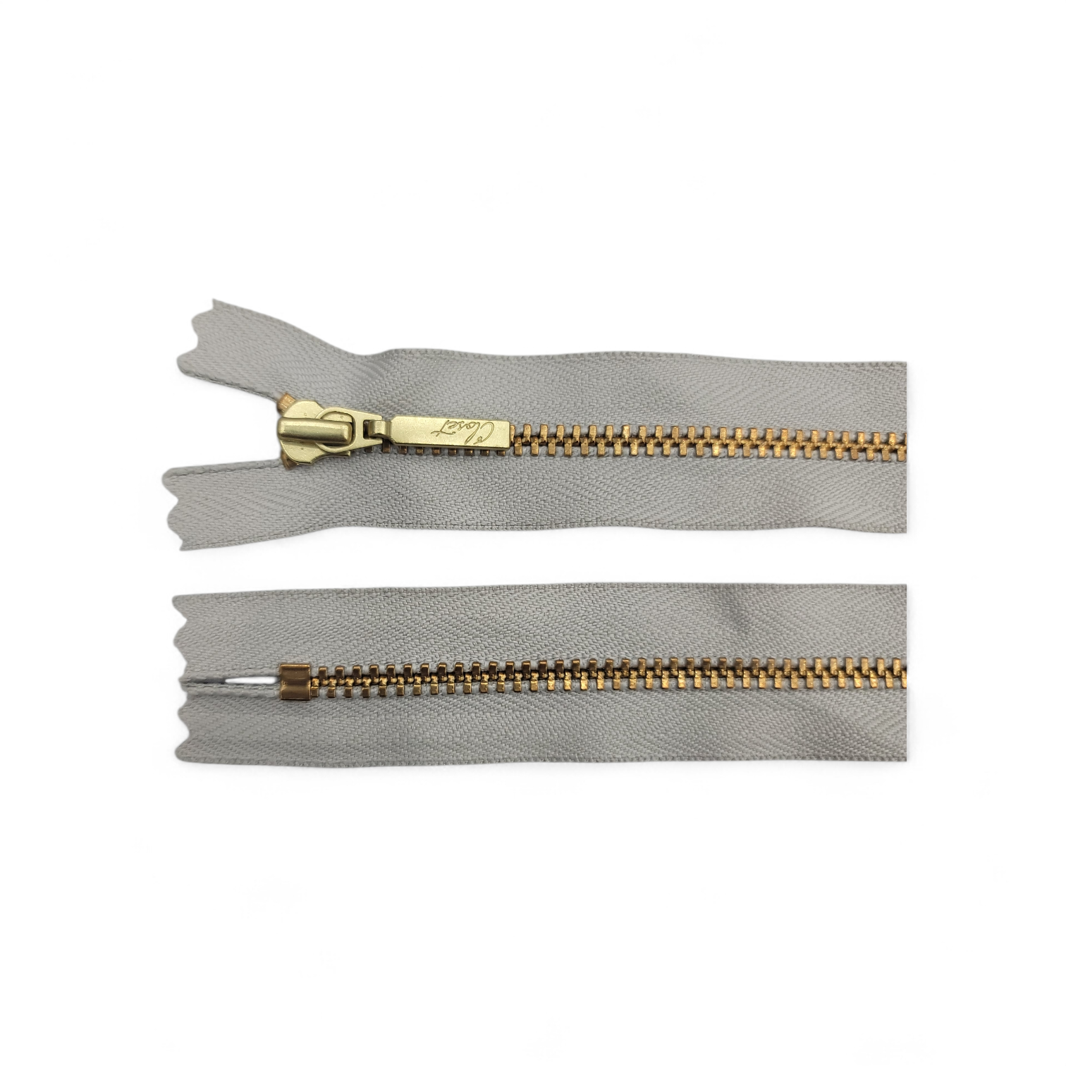 YKK size 3 closed end gold metal zip with grey tape.