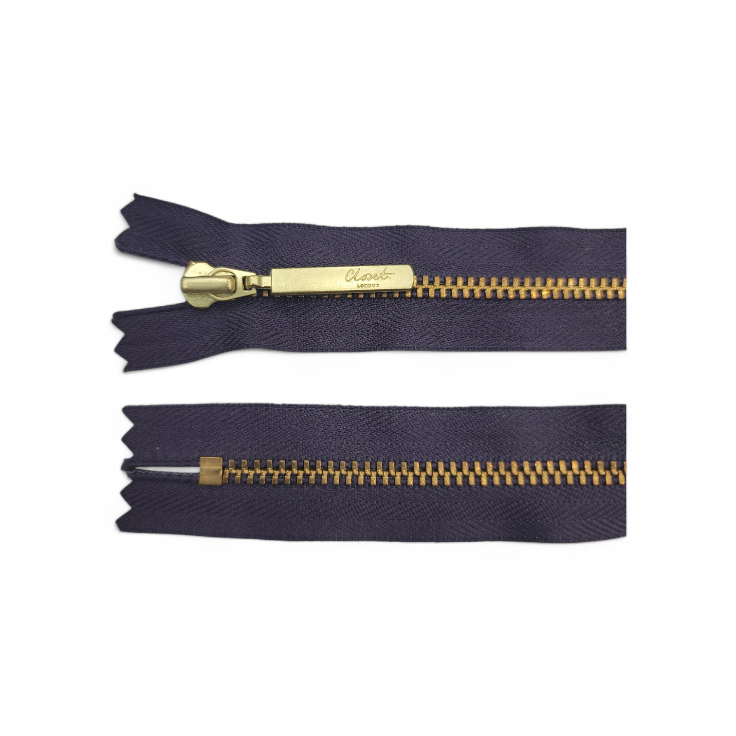 YKK size 3 closed end gold metal zip with navy fabric.