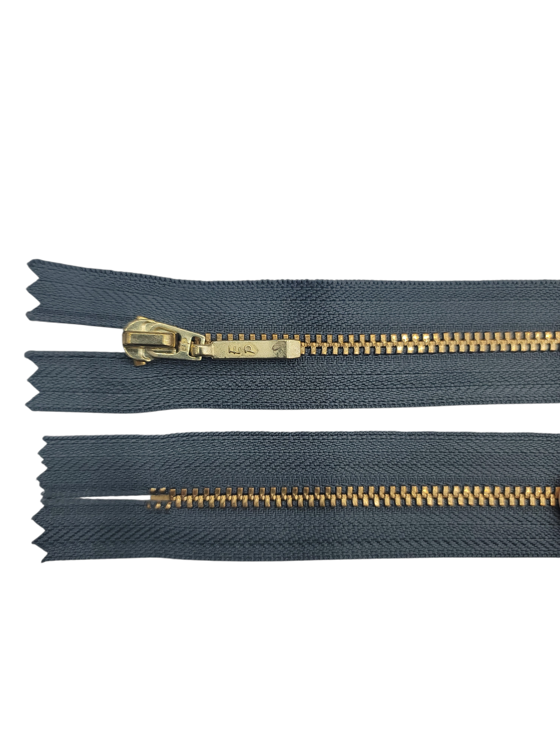 YKK size 3 closed end gold metal zipper with dark grey fabric.
