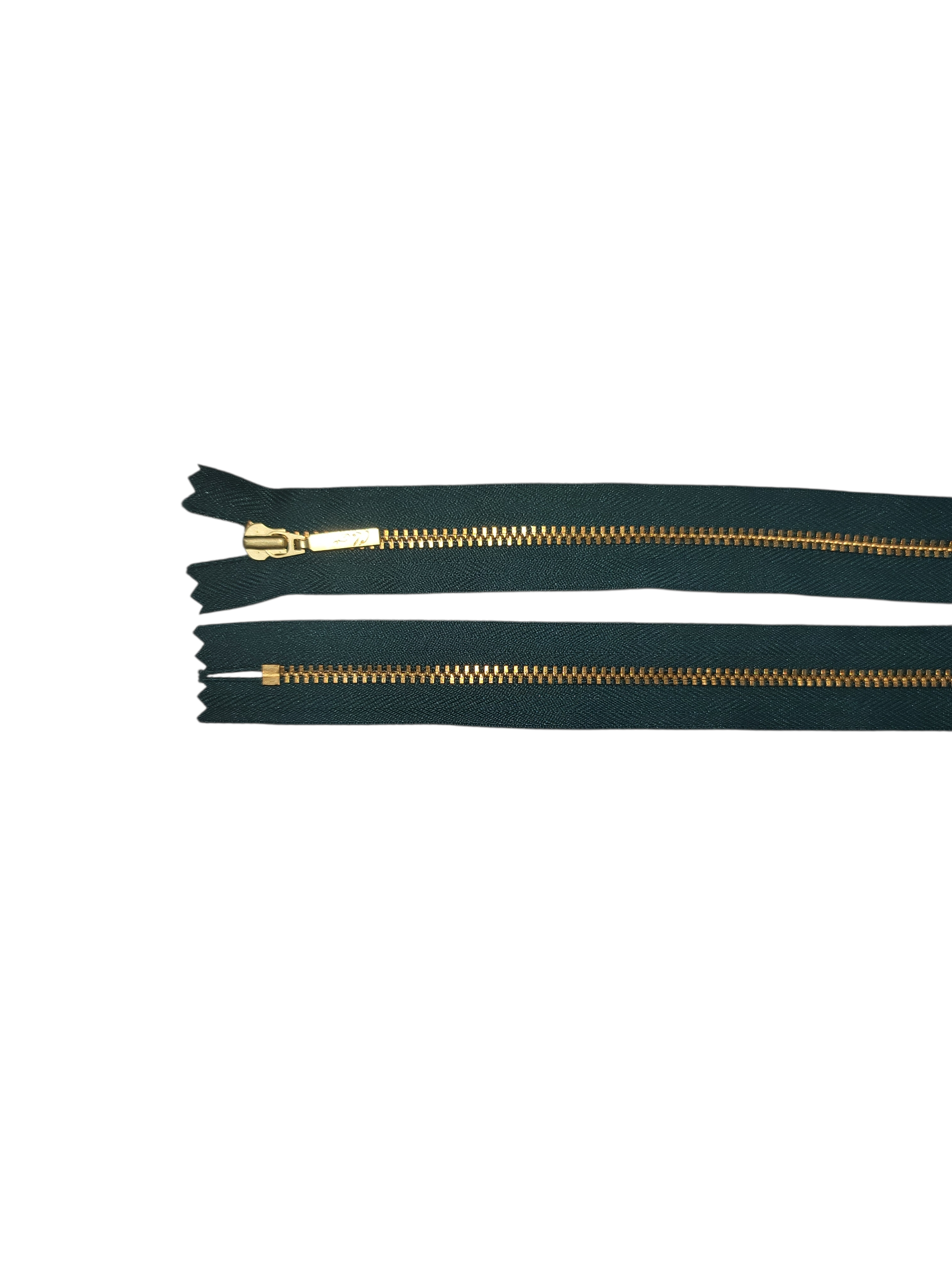 YKK size 3 closed end gold metal zipper on dark green tape.