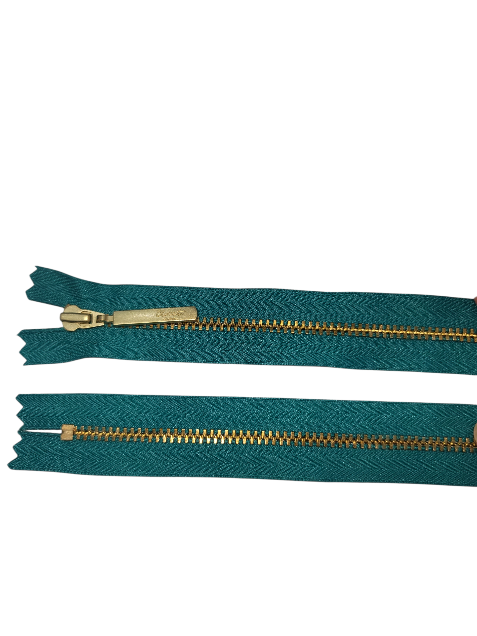 YKK size 3 closed end gold metal zip in teal.