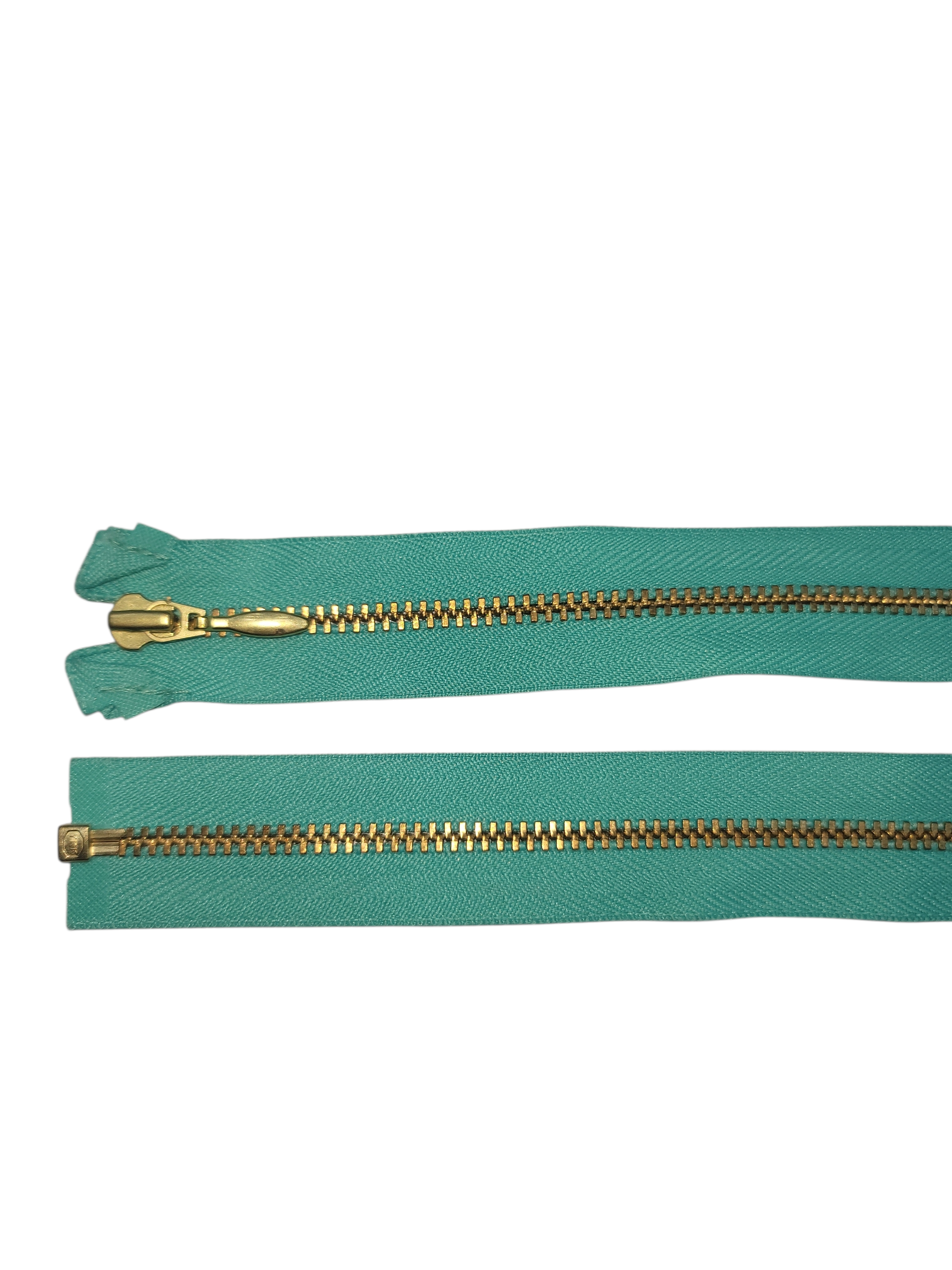 YKK Size 3 open end gold metal zipper on teal fabric.
