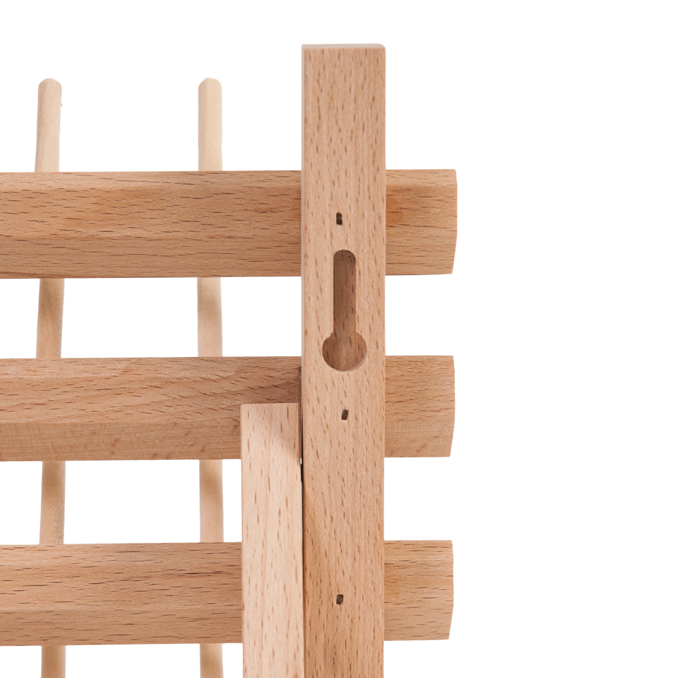 Close-up of a beech wood spool holder showing the built-in screw slot for wall mounting.