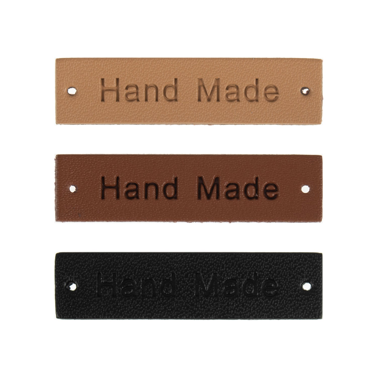 Three rectangular leather labels in tan, brown, and black, each embossed with the words Hand Made.