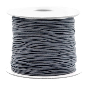 Beadalon grey elastic cord for jewelry making wound on a white spool.