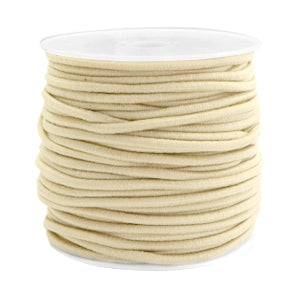 Beadalon cream-colored elastic cord for jewelry making wound around a white plastic spool.