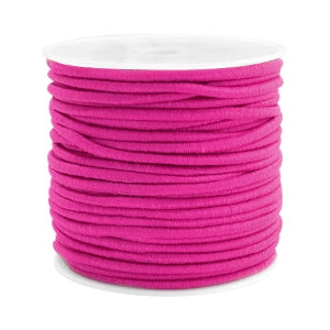 Spool of vibrant pink Beadalon elastic cord for jewelry making and crafting.