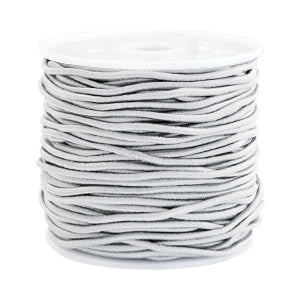 A spool of light grey Beadalon elastic cord for jewelry making.