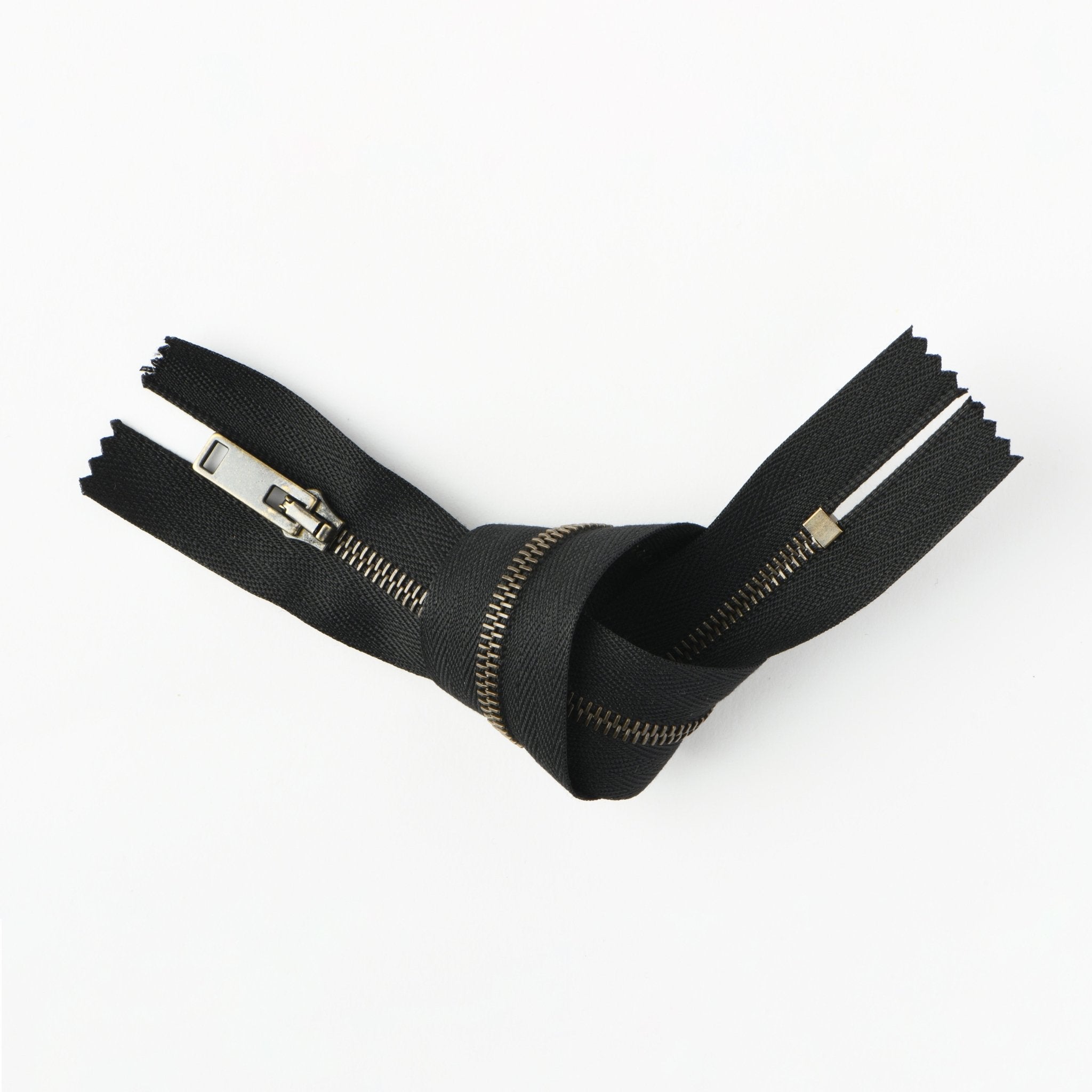 RIRI brass-colored metal closed-end zipper, 24cm.