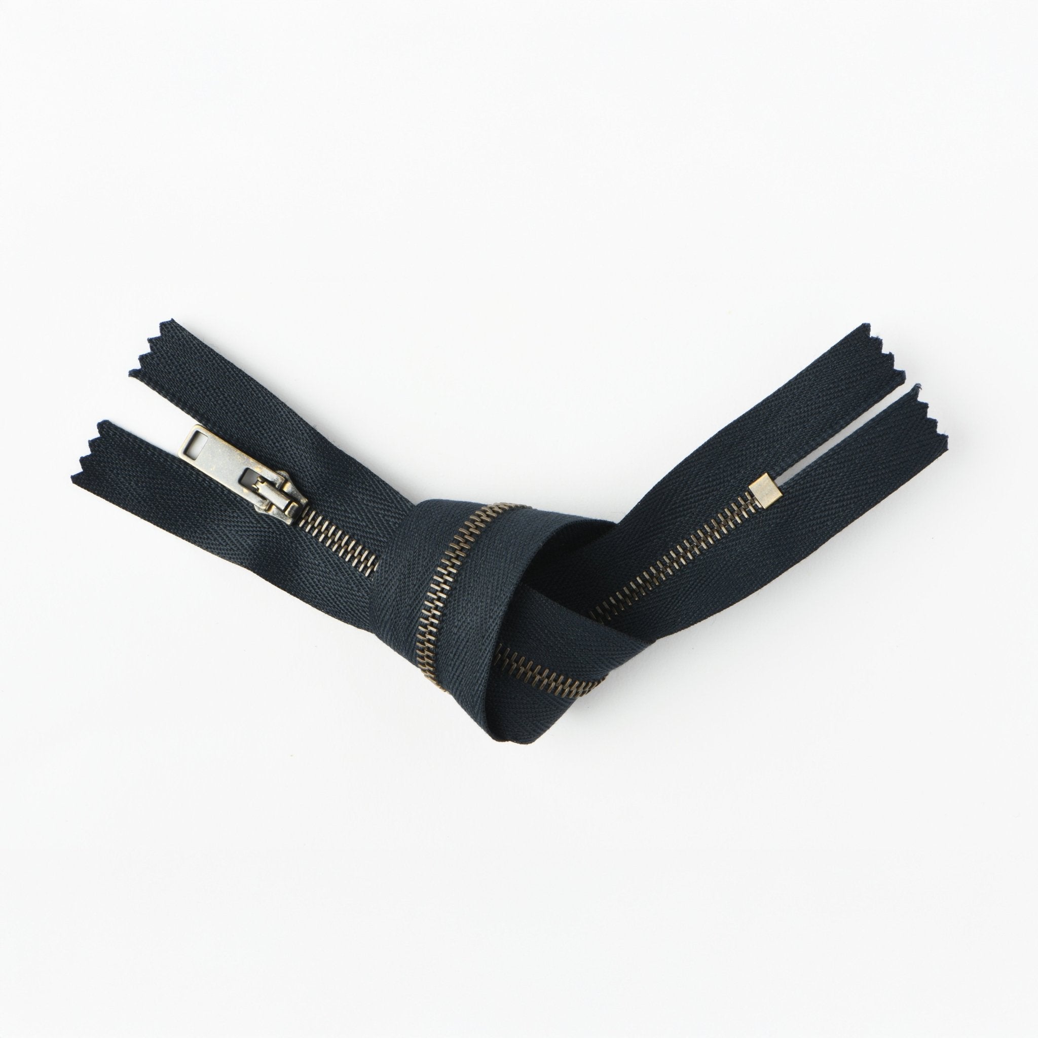 RIRI brass-colored metal closed-end zipper, 24cm.