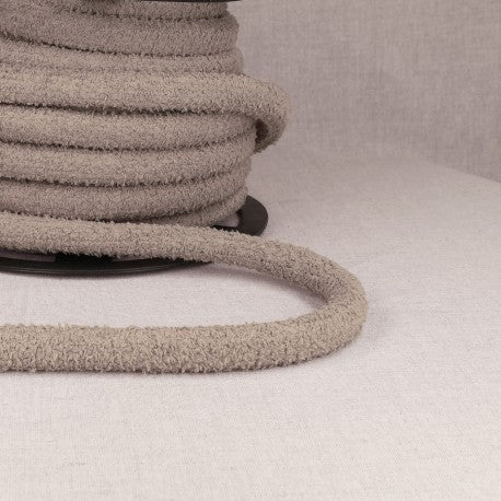 A spool of thick, grey, textured cord with a looped end.