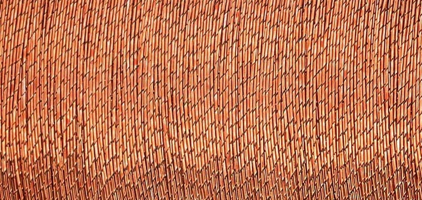 Close-up of Madeira Metallic No.40 Copper embroidery thread wound on a spool.