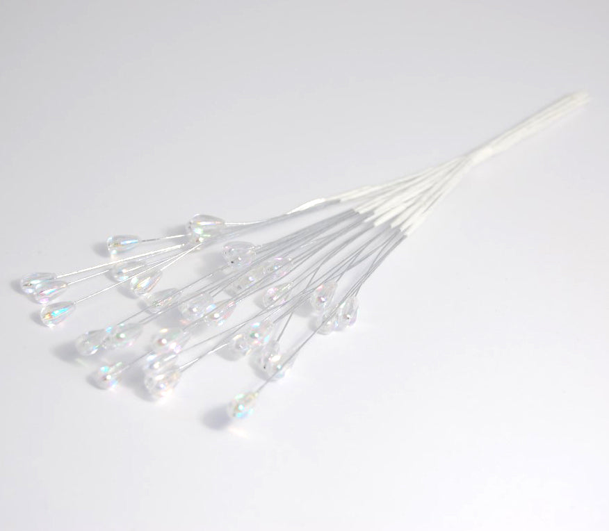 Six iridescent clear 3mm pearl teardrop sprays on silver wire stems.