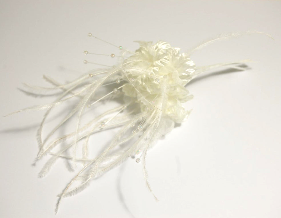 White feather blossom hair accessory with delicate beads and wispy feathers, 15cm.
