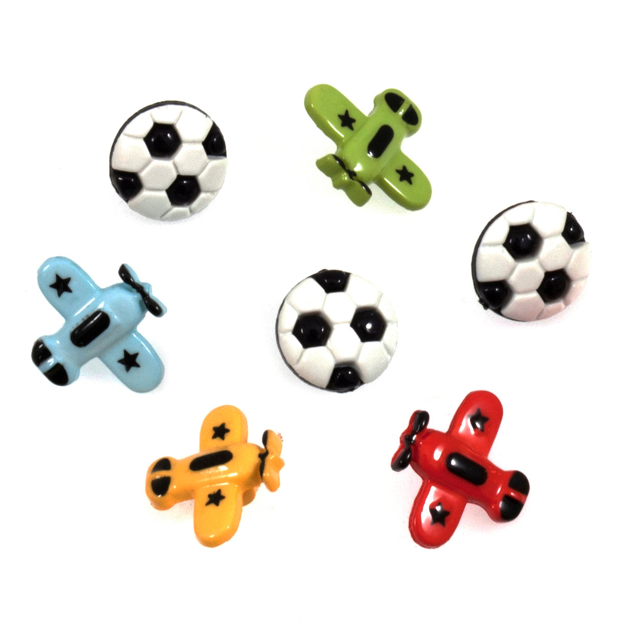 A pack of seven novelty shank buttons featuring three soccer balls and four colorful airplanes.