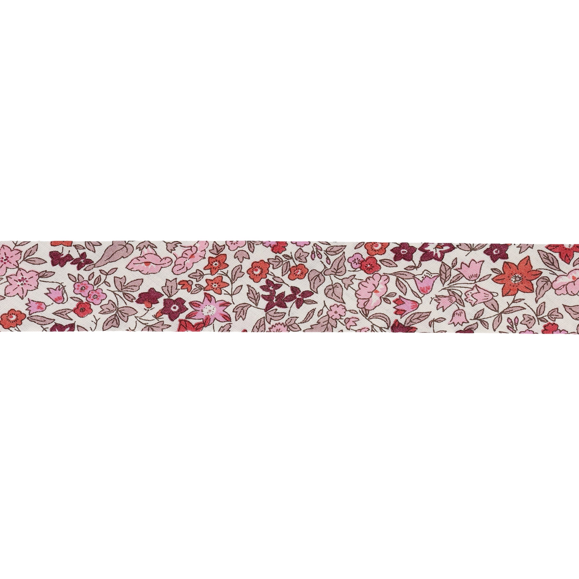 Liberty print bias binding with a pink and red floral pattern on a cream background.