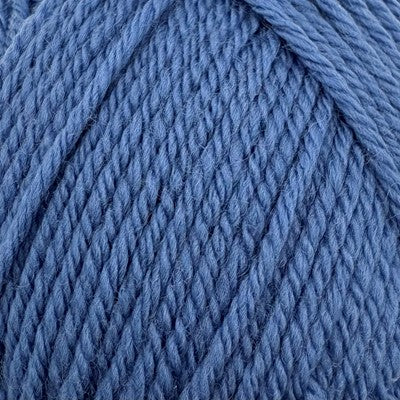 Close-up of Stylecraft Naturals Pure Wool DK yarn in Denim blue showing twisted stitch definition.