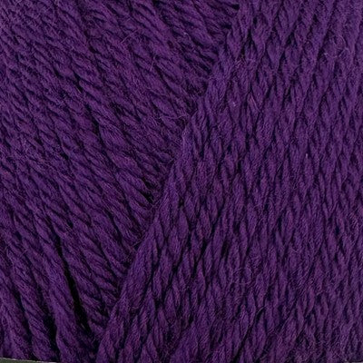 Close-up of Stylecraft Naturals Pure Wool DK yarn in a deep purple Emperor shade.
